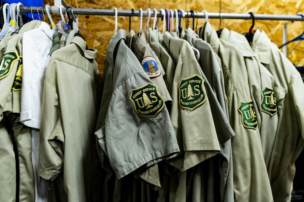 United States Forest Service uniforms hang in storage at the Wayne National Forest facility off of US Route 33 in Athens County, Ohio. 